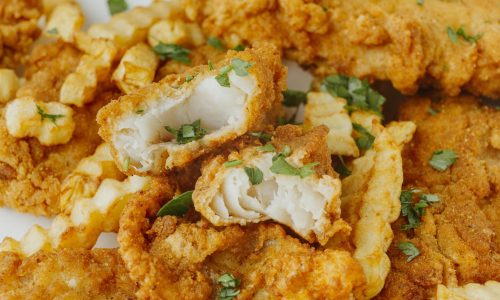 close-up-fish-chips-with-herbs