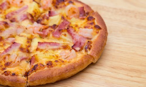 Pizza on wooden background