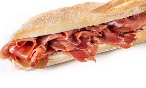 Spanish serrano ham sandwich isolated on white background